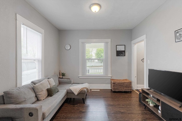 4411 Commercial Ave, Omaha, NE 68110 - living area featuring dark wood finished floors and baseboards