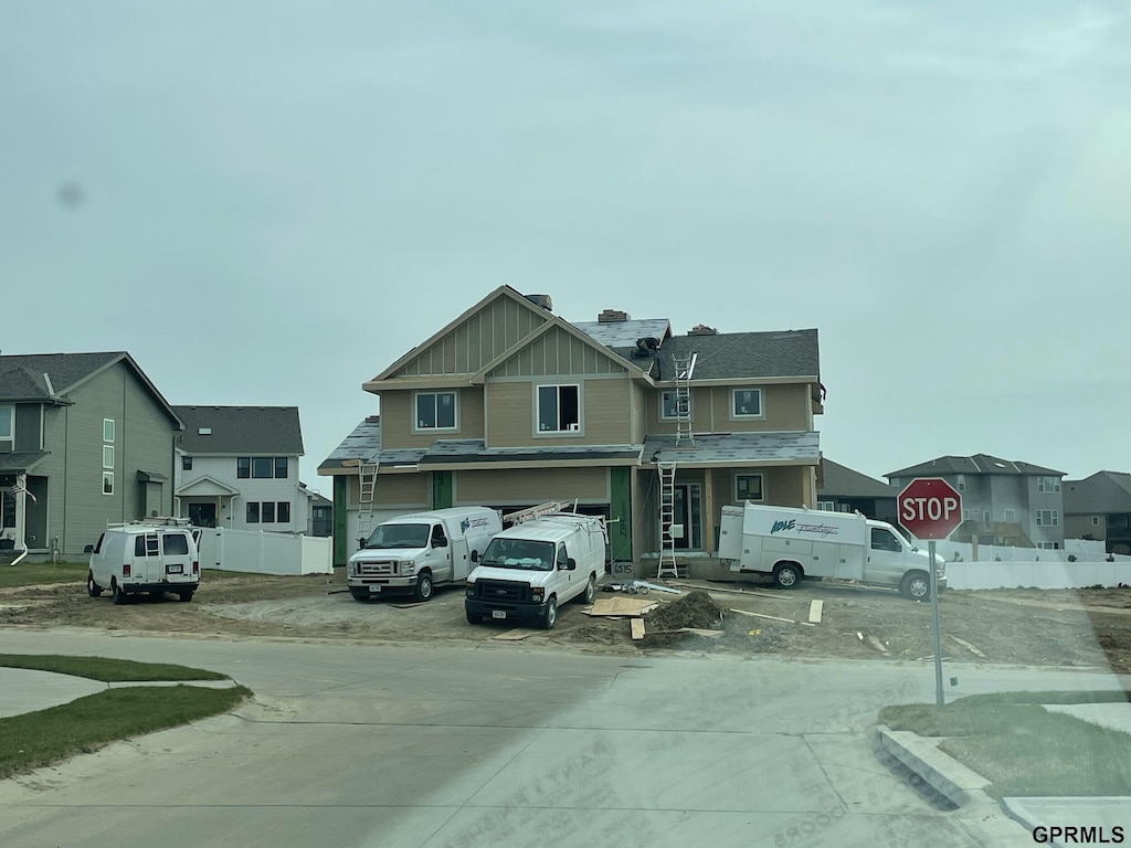 6515 S 199th Ave, Omaha, NE 68135 - view of concrete road featuring traffic signs and a residential view