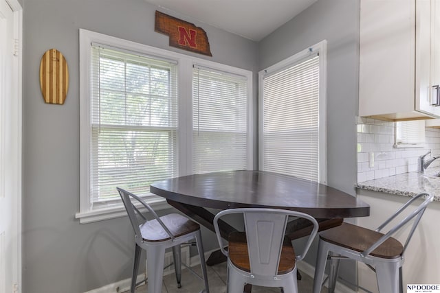 3185 Stone Ave, Omaha, NE 68111 - dining space featuring baseboards