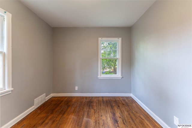 3185 Stone Ave, Omaha, NE 68111 - unfurnished room with dark wood-style floors and baseboards