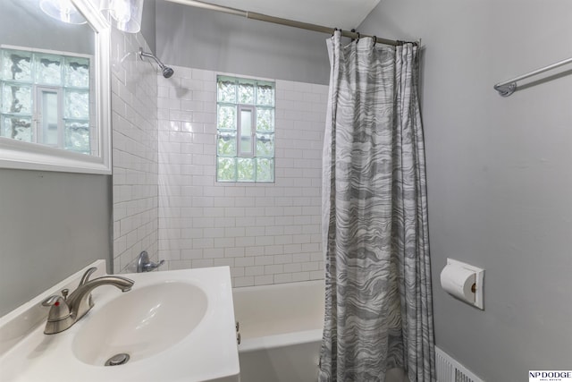 3185 Stone Ave, Omaha, NE 68111 - bathroom with shower / bath combination with curtain and vanity