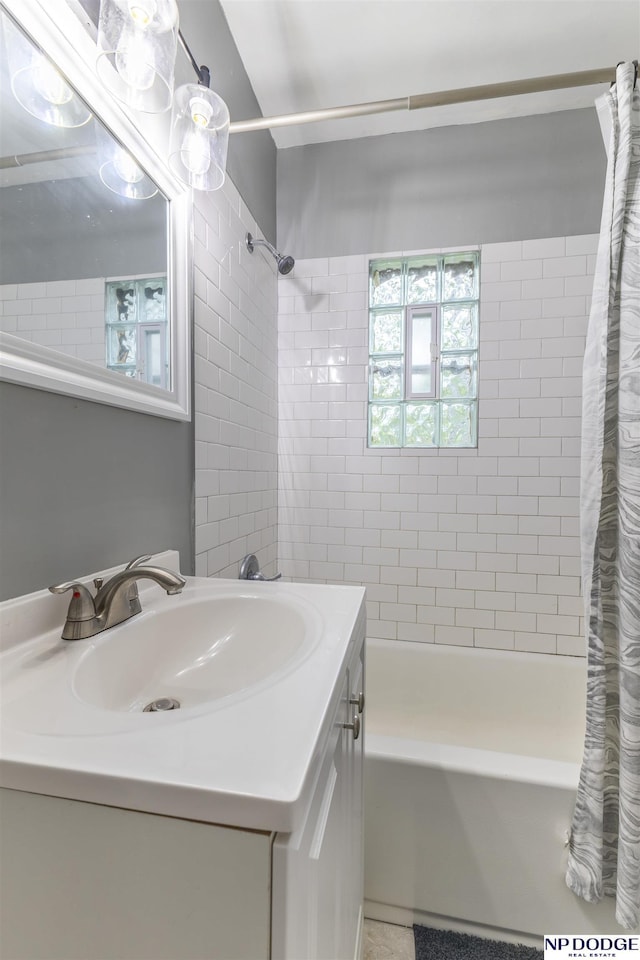 3185 Stone Ave, Omaha, NE 68111 - full bathroom with shower / bath combo with shower curtain and vanity