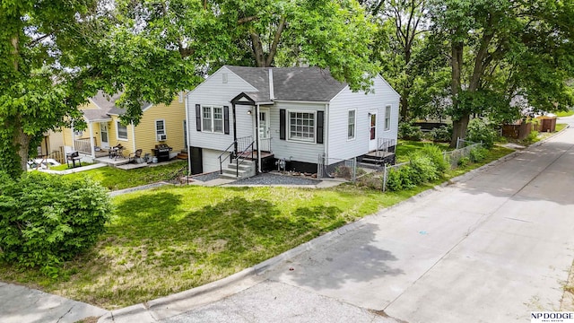 3185 Stone Ave, Omaha, NE 68111 - bungalow with a front lawn and a shingled roof