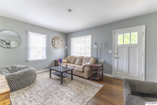 3185 Stone Ave, Omaha, NE 68111 - living room with dark wood finished floors and baseboards