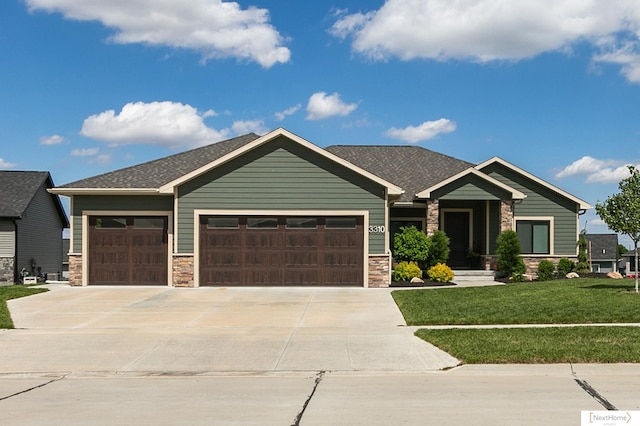 3310 N 92nd St, Lincoln, NE 68507 - craftsman house with an attached garage, stone siding, driveway, a front lawn, and a shingled roof