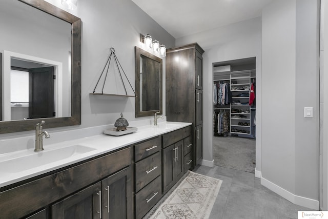 3310 N 92nd St, Lincoln, NE 68507 - full bath featuring double vanity, baseboards, and a walk in closet