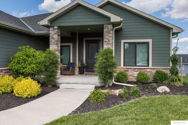3310 N 92nd St, Lincoln, NE 68507 - view of front of home with a porch, stone siding, and a shingled roof