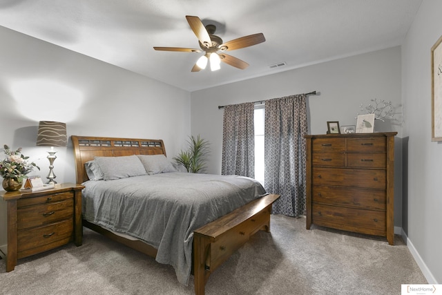 3310 N 92nd St, Lincoln, NE 68507 - bedroom featuring light carpet, baseboards, and a ceiling fan