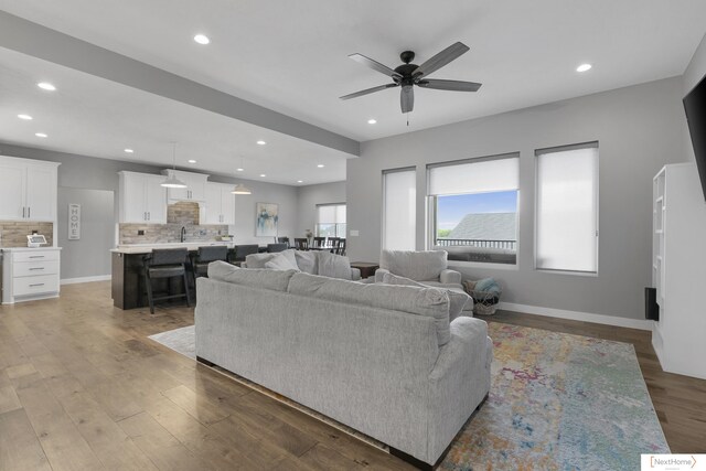 3310 N 92nd St, Lincoln, NE 68507 - living area featuring ceiling fan, recessed lighting, wood finished floors, and baseboards