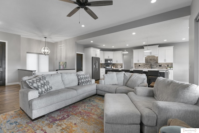 3310 N 92nd St, Lincoln, NE 68507 - living area with recessed lighting, a ceiling fan, dark wood-style floors, and baseboards