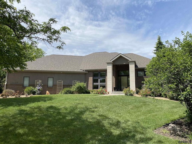 6500 Pheasant Run Ct, Lincoln, NE 68516 - view of front of home with a front lawn, a shingled roof, and brick siding