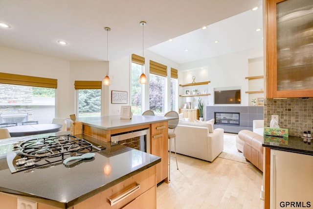 6500 Pheasant Run Ct, Lincoln, NE 68516 - kitchen featuring open floor plan, gas cooktop, light wood finished floors, plenty of natural light, and recessed lighting