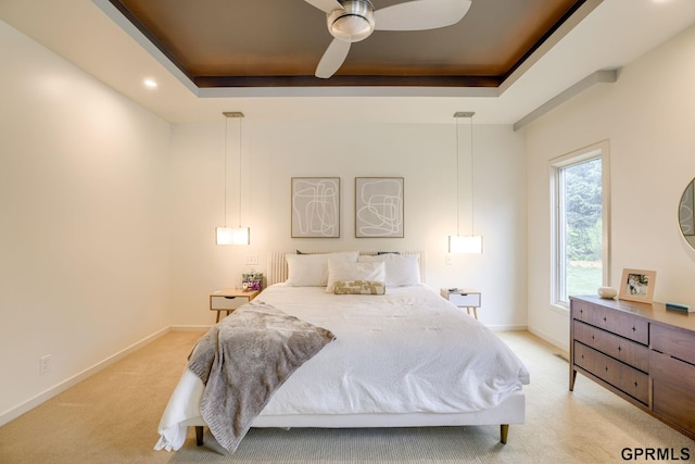 6500 Pheasant Run Ct, Lincoln, NE 68516 - bedroom with light colored carpet, a tray ceiling, baseboards, recessed lighting, and a ceiling fan