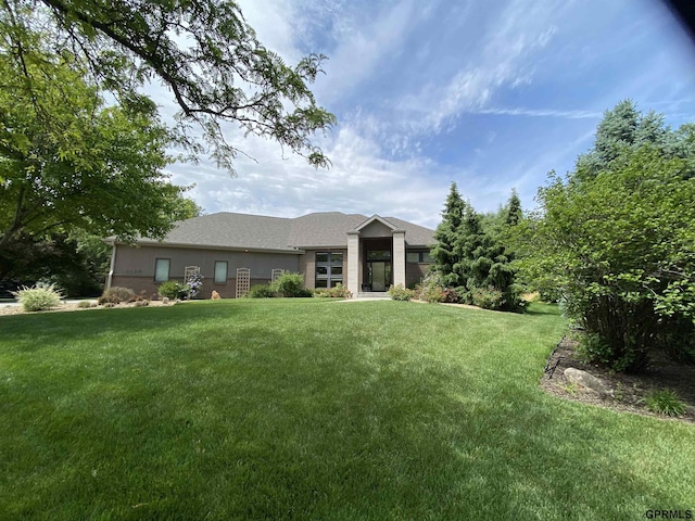 6500 Pheasant Run Ct, Lincoln, NE 68516 - view of front facade featuring a front yard, brick siding, and roof with shingles