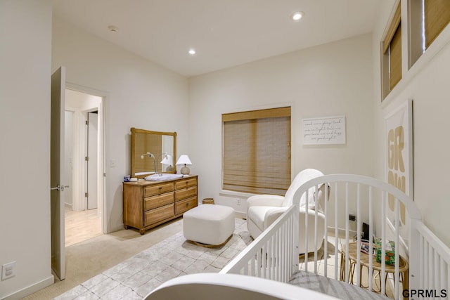6500 Pheasant Run Ct, Lincoln, NE 68516 - bedroom featuring light carpet, recessed lighting, and a crib