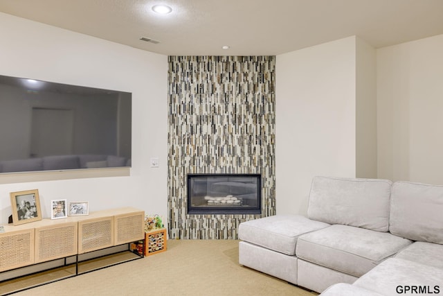 6500 Pheasant Run Ct, Lincoln, NE 68516 - carpeted living area featuring recessed lighting and a glass covered fireplace