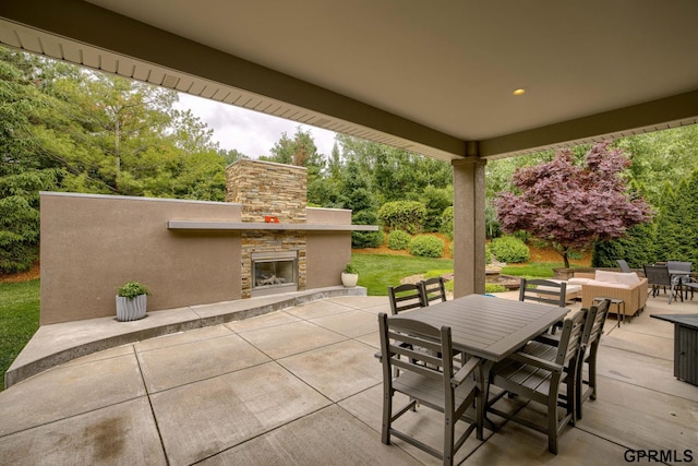 6500 Pheasant Run Ct, Lincoln, NE 68516 - view of patio / terrace featuring outdoor dining area and an outdoor living space with a fireplace