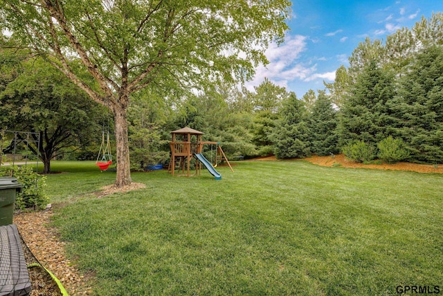 6500 Pheasant Run Ct, Lincoln, NE 68516 - view of green lawn with a playground