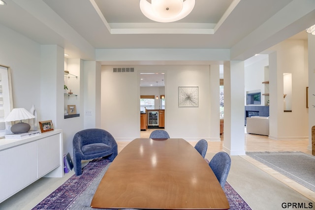 6500 Pheasant Run Ct, Lincoln, NE 68516 - dining area with wine cooler and a tray ceiling