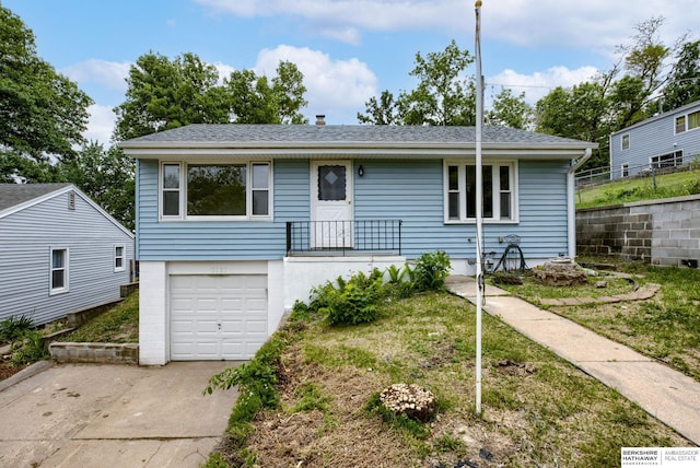 3121 State St, Omaha, NE 68112 - view of front of property with an attached garage, concrete driveway, and roof with shingles