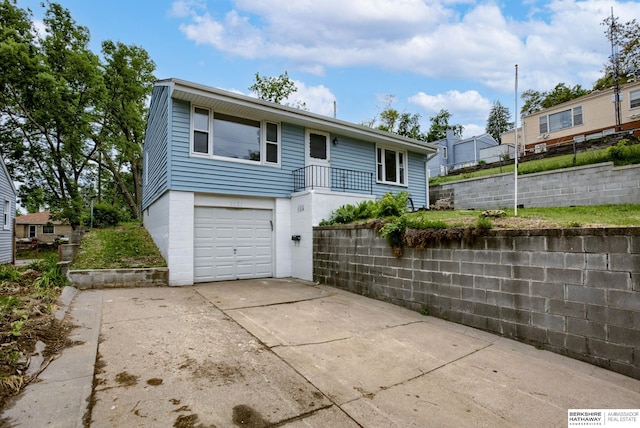 3121 State St, Omaha, NE 68112 - view of front of house with an attached garage and driveway