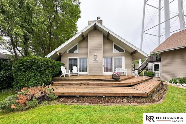 2203 Beaver Lake Blvd, Plattsmouth, NE 68048 - rear view of house featuring a wooden deck, a chimney, and a lawn