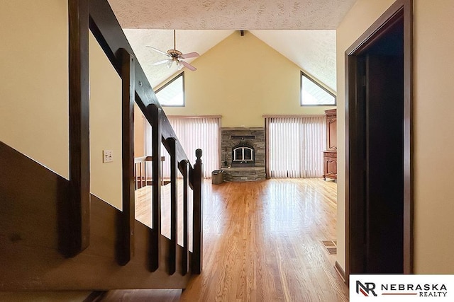 2203 Beaver Lake Blvd, Plattsmouth, NE 68048 - corridor featuring light wood finished floors and high vaulted ceiling