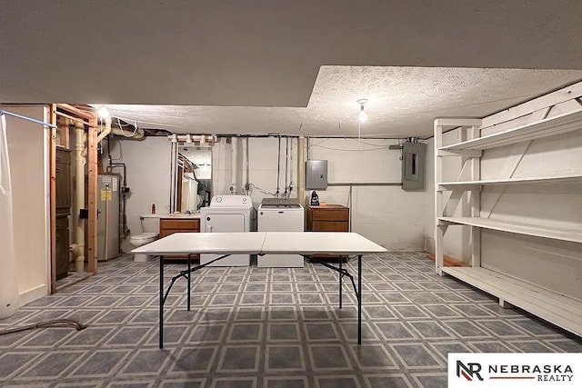 2203 Beaver Lake Blvd, Plattsmouth, NE 68048 - finished basement featuring separate washer and dryer, electric panel, gas water heater, and a textured ceiling