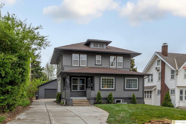 5009 Burt St, Omaha, NE 68132 - american foursquare style home featuring an outdoor structure, a front lawn, and a garage