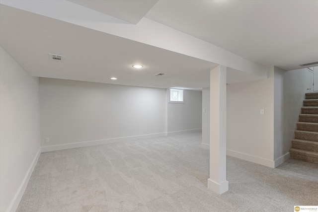 5009 Burt St, Omaha, NE 68132 - below grade area featuring stairs, light colored carpet, recessed lighting, and baseboards
