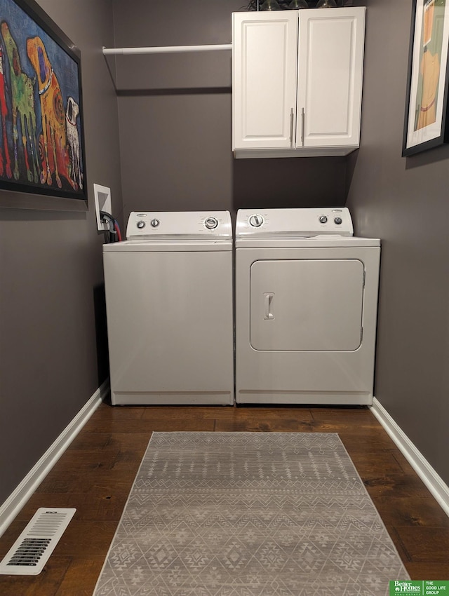948 S 183rd St, Elkhorn, NE 68022 - washroom with separate washer and dryer, cabinet space, baseboards, and dark wood-type flooring