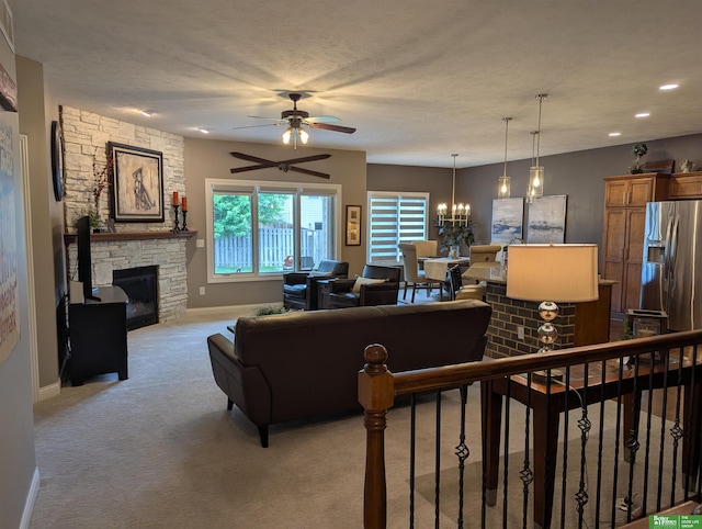 948 S 183rd St, Elkhorn, NE 68022 - living area with light colored carpet, a ceiling fan, baseboards, a fireplace, and recessed lighting
