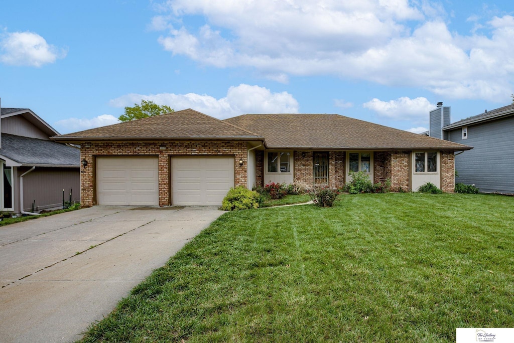 6317 S 94th St, Ralston, NE 68127 - ranch-style house featuring a garage, concrete driveway, a front lawn, brick siding, and a shingled roof