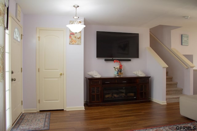 7014 N 89th St, Omaha, NE 68122 - foyer entrance with wood finished floors, stairs, and baseboards