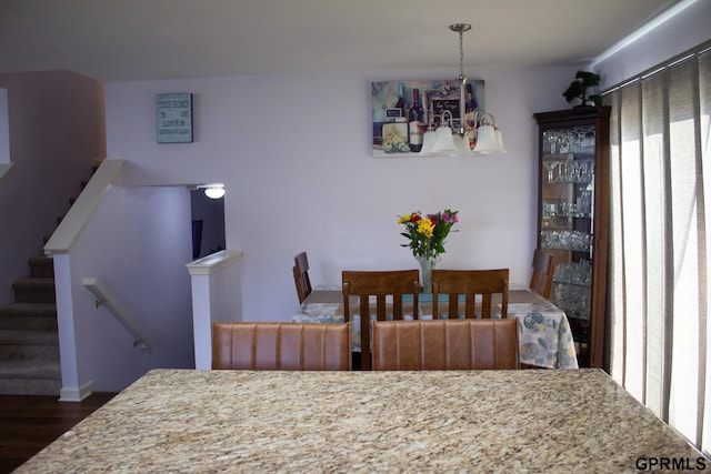 7014 N 89th St, Omaha, NE 68122 - dining space with a chandelier and dark wood finished floors