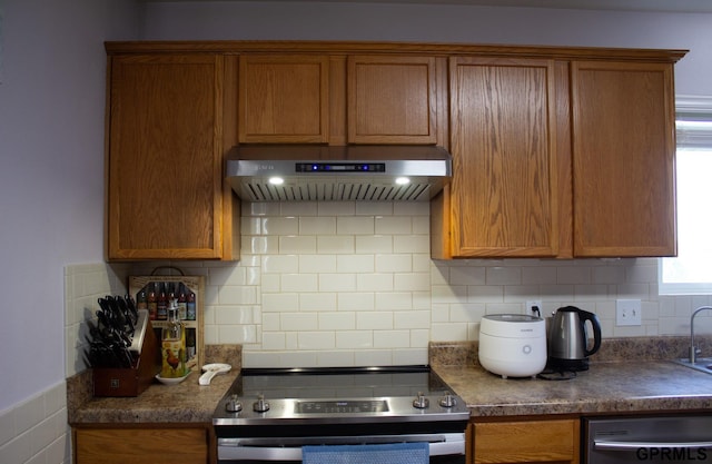 7014 N 89th St, Omaha, NE 68122 - kitchen featuring appliances with stainless steel finishes, extractor fan, and brown cabinets
