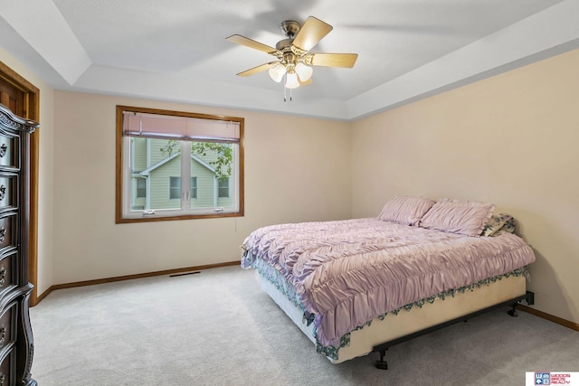7432 Grand Oaks Dr, Lincoln, NE 68516 - bedroom featuring a raised ceiling, carpet floors, baseboards, and ceiling fan