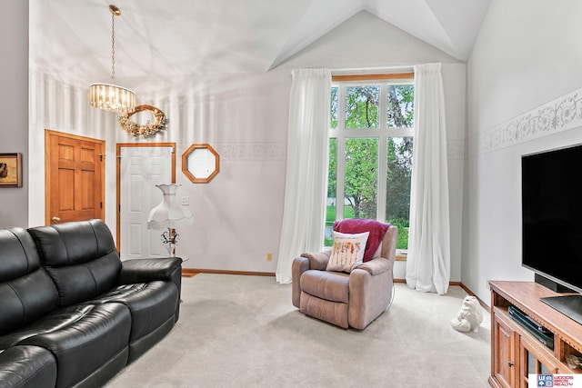 7432 Grand Oaks Dr, Lincoln, NE 68516 - living room featuring a chandelier, light carpet, lofted ceiling, and baseboards