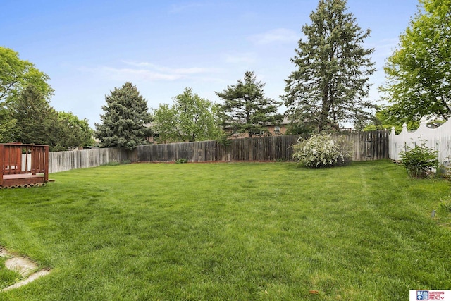 7432 Grand Oaks Dr, Lincoln, NE 68516 - view of yard with a deck