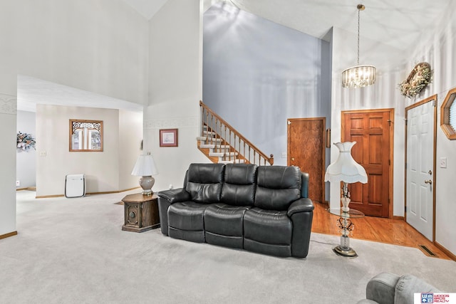 7432 Grand Oaks Dr, Lincoln, NE 68516 - living area featuring high vaulted ceiling, a chandelier, baseboards, carpet floors, and stairway