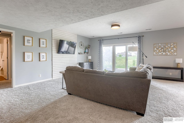 9711 S 176th St, Omaha, NE 68136 - carpeted living room featuring baseboards and a textured ceiling