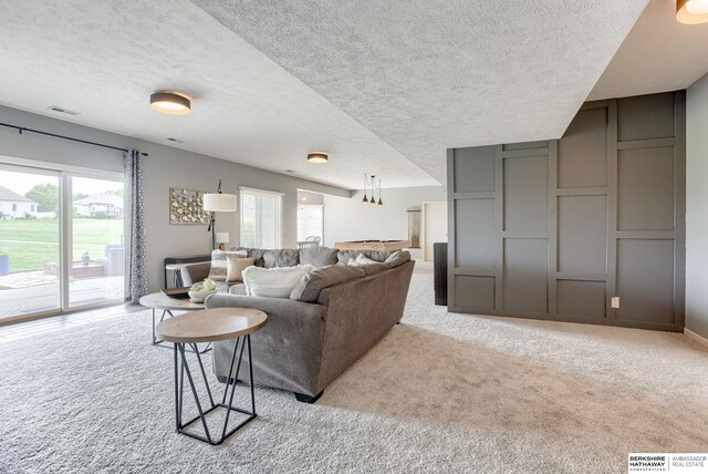 9711 S 176th St, Omaha, NE 68136 - living room with carpet flooring and a textured ceiling