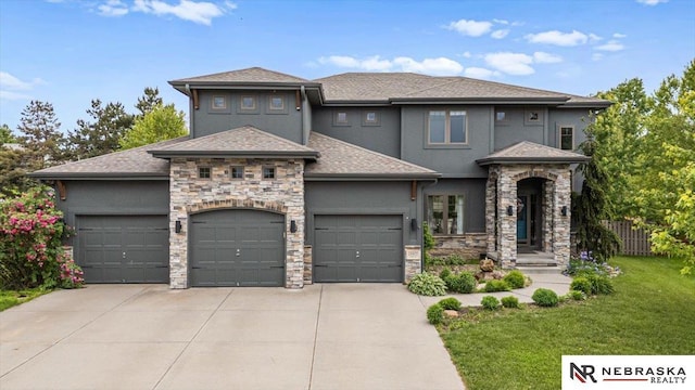 18402 Polk St, Omaha, NE 68135 - prairie-style house with concrete driveway, a garage, a front yard, and stone siding