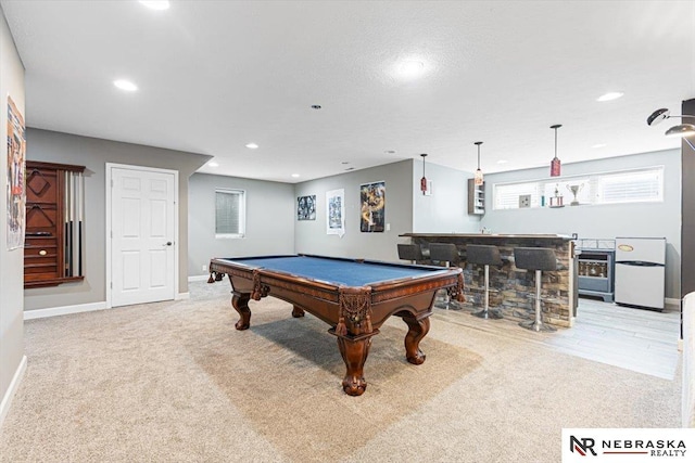 18402 Polk St, Omaha, NE 68135 - playroom with pool table, baseboards, recessed lighting, light carpet, and bar area