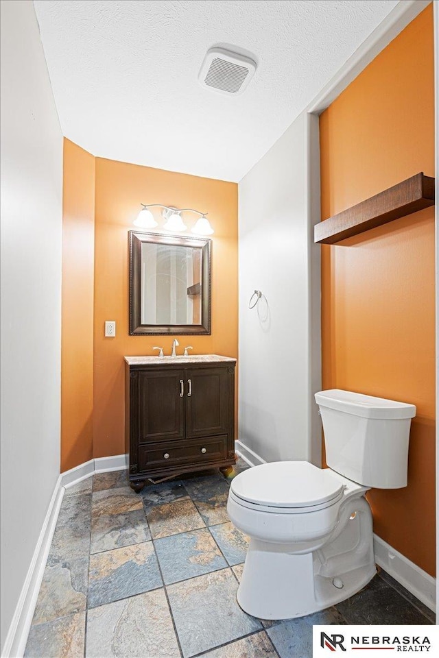18402 Polk St, Omaha, NE 68135 - bathroom with toilet, stone tile flooring, and baseboards