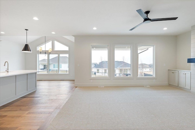 17018 Daniel St, Bennington, NE 68007 - unfurnished living room featuring a sink, ceiling fan, recessed lighting, light wood-style flooring, and baseboards