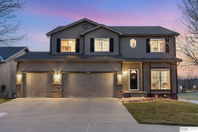 4706 S 187th Ave, Omaha, NE 68135 - traditional home featuring driveway, a lawn, a garage, and roof with shingles