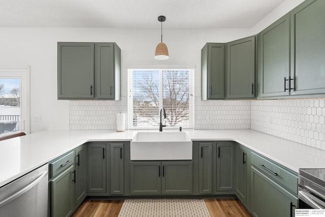 4706 S 187th Ave, Omaha, NE 68135 - kitchen featuring a sink, dishwasher, green cabinets, and light countertops