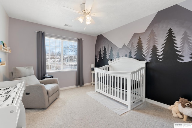 4706 S 187th Ave, Omaha, NE 68135 - carpeted bedroom with a crib, baseboards, and ceiling fan