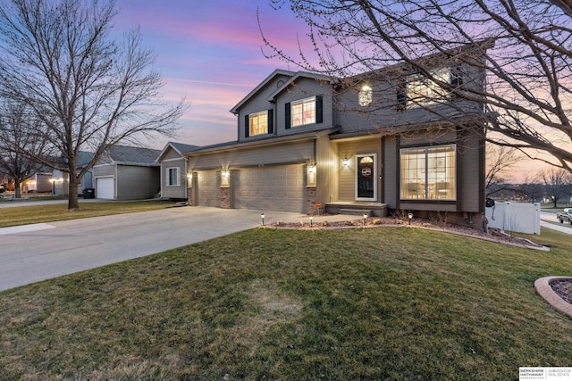 4706 S 187th Ave, Omaha, NE 68135 - traditional-style home featuring concrete driveway, a garage, and a yard
